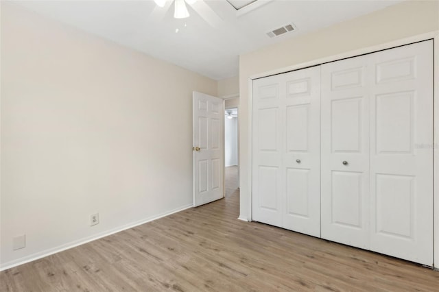 411 Sheoah Blvd Unit 33, Winter Springs, FL 32708 - unfurnished bedroom with light wood finished floors, a closet, baseboards, and ceiling fan
