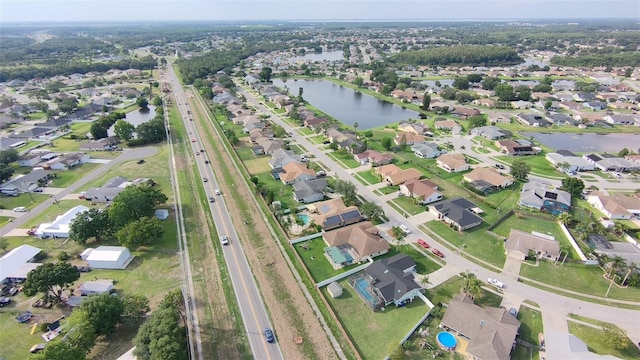 2410 Sweetwater Blvd, Saint Cloud, FL 34772 - aerial overview of property's location featuring a nearby body of water, nearby suburban area, and a highway