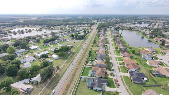 2410 Sweetwater Blvd, Saint Cloud, FL 34772 - aerial view of property and surrounding area with a nearby body of water, a major roadway, and nearby suburban area