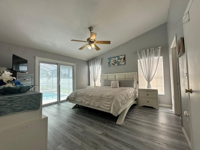 2410 Sweetwater Blvd, Saint Cloud, FL 34772 - bedroom with vaulted ceiling, access to outside, wood finished floors, baseboards, and a textured ceiling