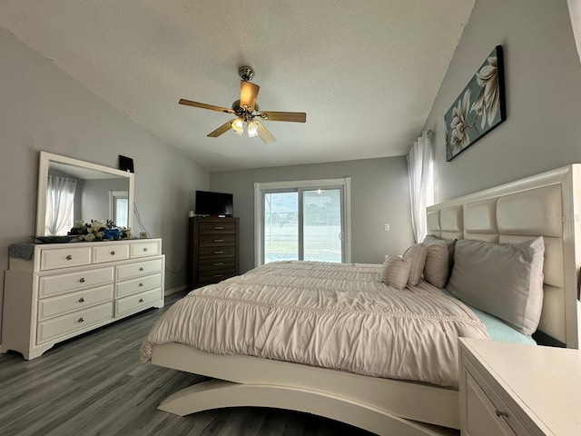 2410 Sweetwater Blvd, Saint Cloud, FL 34772 - bedroom with dark wood-style flooring, access to outside, ceiling fan, and a textured ceiling