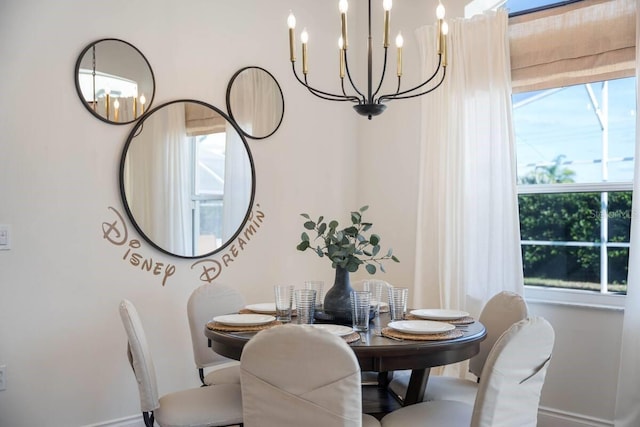 344 High Point Dr, Davenport, FL 33837 - dining space with a chandelier, plenty of natural light, and baseboards