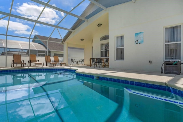 344 High Point Dr, Davenport, FL 33837 - outdoor pool featuring a patio area, outdoor dining space, and glass enclosure