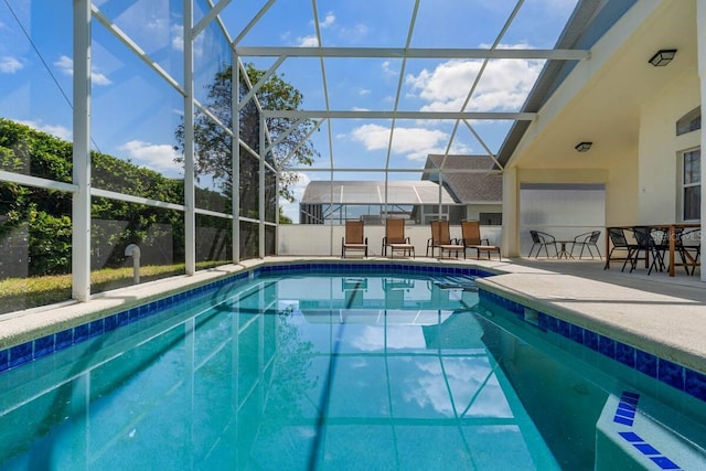 344 High Point Dr, Davenport, FL 33837 - swimming pool featuring glass enclosure and a patio