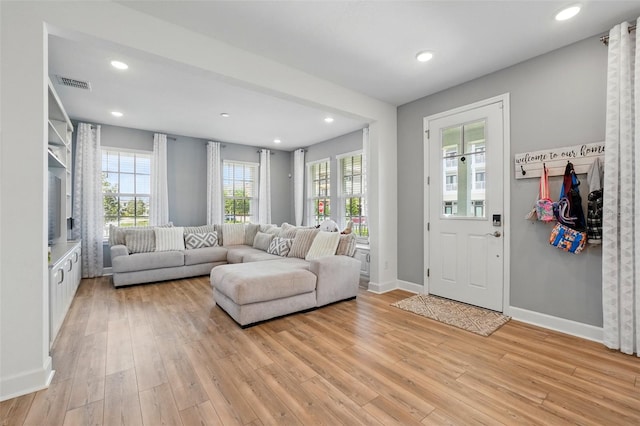 7400 Estuary Lake Loop, Celebration, FL 34747 - living area featuring light wood-type flooring, healthy amount of natural light, and recessed lighting