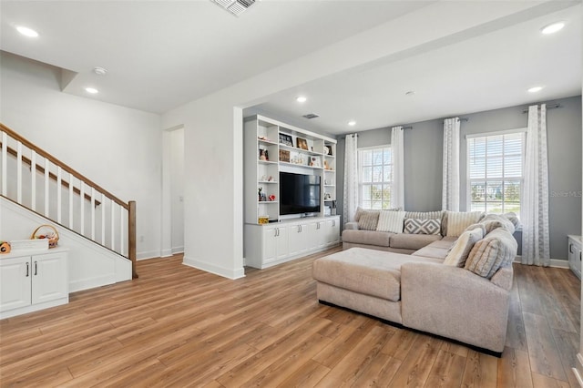 7400 Estuary Lake Loop, Celebration, FL 34747 - living area featuring light wood-style floors, stairway, and recessed lighting