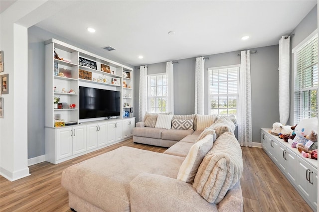 7400 Estuary Lake Loop, Celebration, FL 34747 - living room with light wood-style floors and recessed lighting
