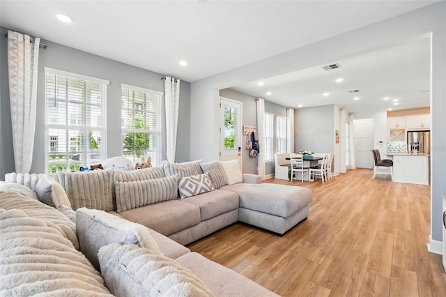 7400 Estuary Lake Loop, Celebration, FL 34747 - living area with light wood-style floors and recessed lighting