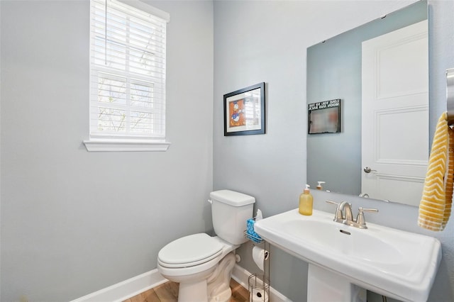 7400 Estuary Lake Loop, Celebration, FL 34747 - half bath featuring baseboards and wood finished floors