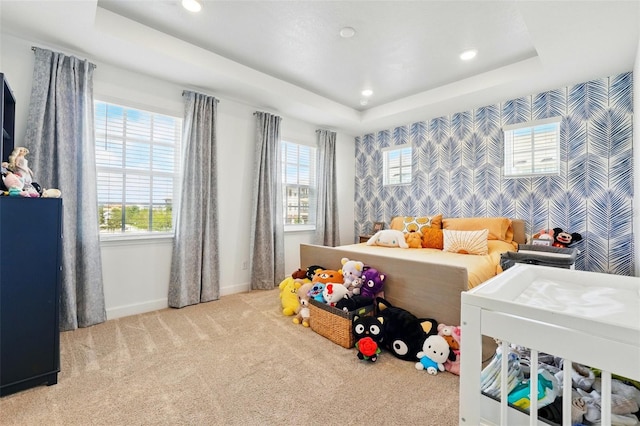 7400 Estuary Lake Loop, Celebration, FL 34747 - carpeted bedroom with a tray ceiling, recessed lighting, multiple windows, wallpapered walls, and an accent wall