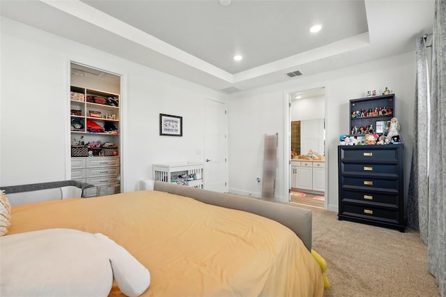 7400 Estuary Lake Loop, Celebration, FL 34747 - bedroom featuring carpet flooring, a tray ceiling, recessed lighting, ensuite bathroom, and a closet