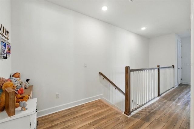 7400 Estuary Lake Loop, Celebration, FL 34747 - hallway with an upstairs landing, light wood-type flooring, and recessed lighting