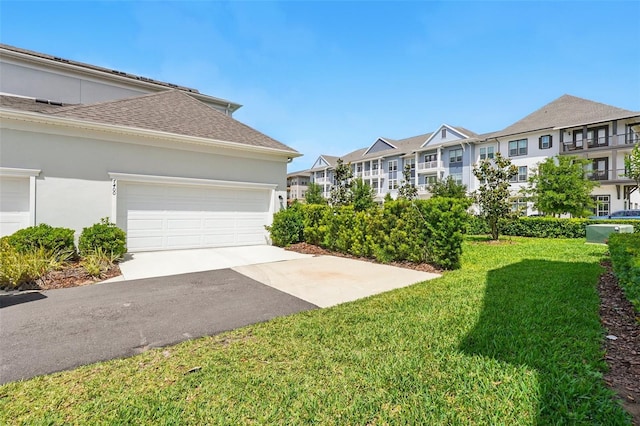7400 Estuary Lake Loop, Celebration, FL 34747 - view of grassy yard featuring a residential view, driveway, and a garage