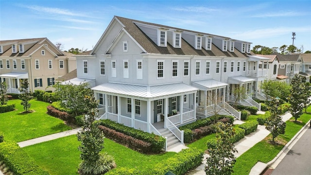 7400 Estuary Lake Loop, Celebration, FL 34747 - view of property with a shingled roof, a porch, stucco siding, a standing seam roof, and a residential view