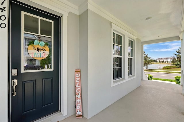 7400 Estuary Lake Loop, Celebration, FL 34747 - view of exterior entry featuring a porch and stucco siding