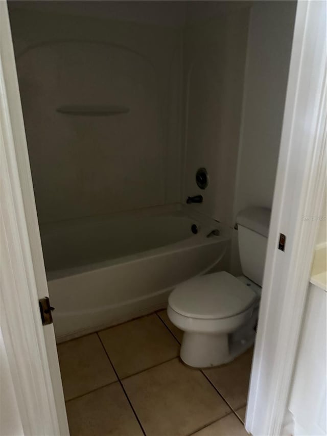 2826 Club Cortile Cir Unit B, Kissimmee, FL 34746 - bathroom with toilet, tile patterned floors, and shower / tub combination