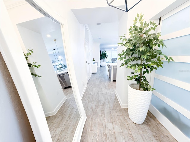 1508BUNKERDRIVE Bunker, Davenport, FL 33896 - hallway featuring light wood-type flooring and baseboards
