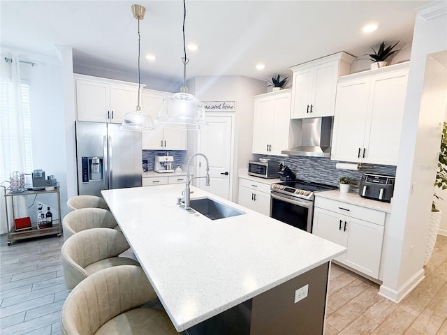 1508BUNKERDRIVE Bunker, Davenport, FL 33896 - kitchen with wall chimney exhaust hood, stainless steel appliances, a sink, backsplash, and a kitchen bar