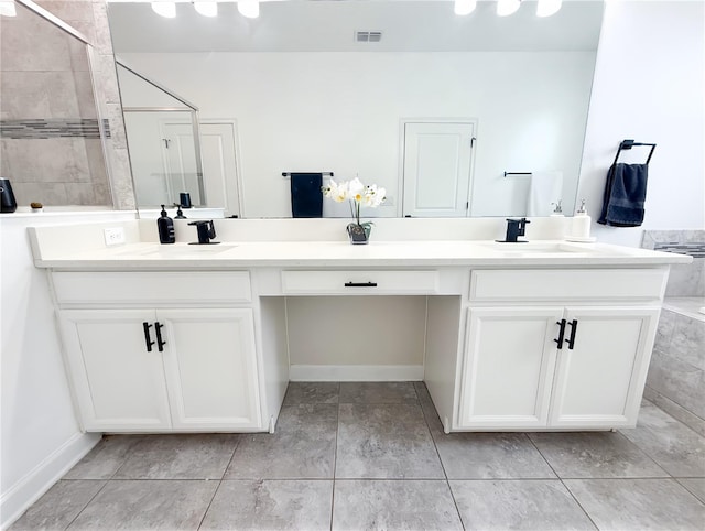 1508BUNKERDRIVE Bunker, Davenport, FL 33896 - bathroom with double vanity, a tile shower, baseboards, and tile patterned flooring