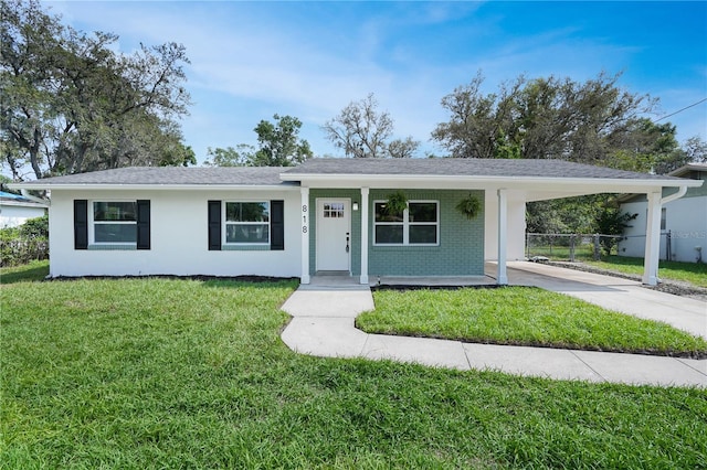 818 Ballard St, Altamonte Springs, FL 32701 - ranch-style home featuring driveway, an attached carport, covered porch, and brick siding