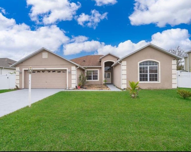 ranch-style home with a garage, concrete driveway, and stucco siding