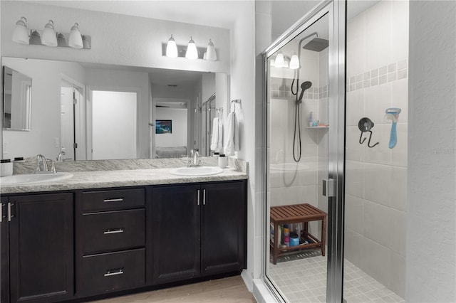 1524 Fleur Dr, Davenport, FL 33837 - bathroom with a stall shower, double vanity, and wood finished floors