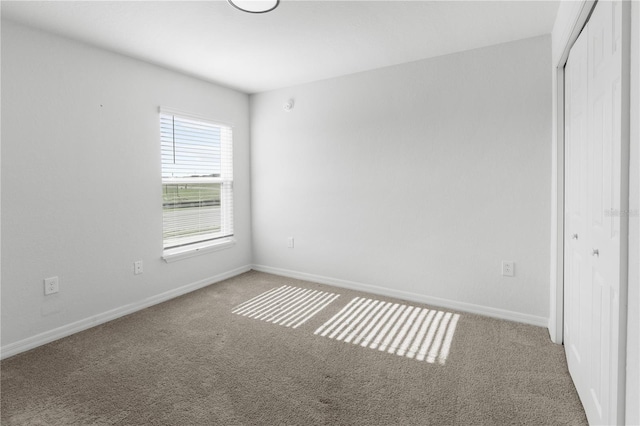 1524 Fleur Dr, Davenport, FL 33837 - unfurnished bedroom featuring a closet, carpet, and baseboards