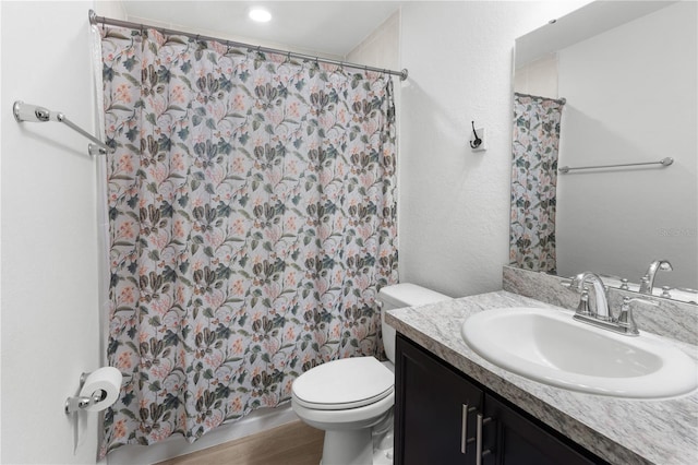 1524 Fleur Dr, Davenport, FL 33837 - bathroom with vanity, toilet, wood finished floors, and curtained shower