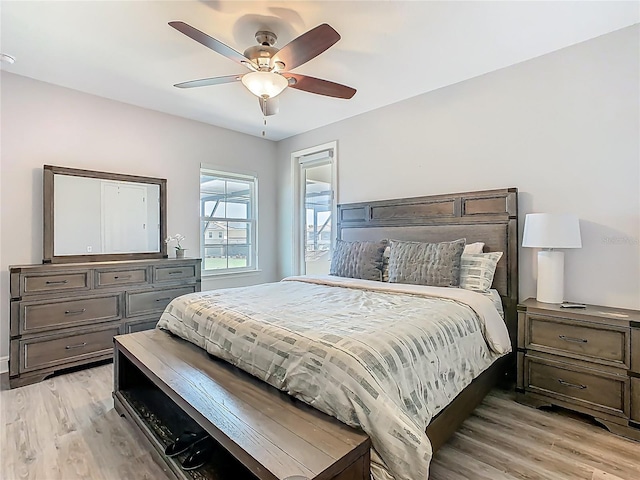 1211 Terralago Way, Kissimmee, FL 34746 - bedroom with light wood-style flooring and ceiling fan