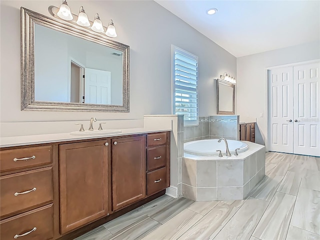 1211 Terralago Way, Kissimmee, FL 34746 - bathroom with vanity and a garden tub