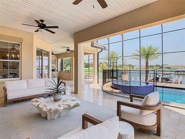 1211 Terralago Way, Kissimmee, FL 34746 - living area with a ceiling fan and stone tile flooring