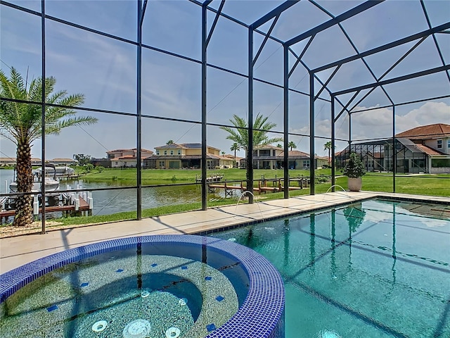 1211 Terralago Way, Kissimmee, FL 34746 - view of swimming pool with glass enclosure, a pool with connected hot tub, a residential view, and a water view