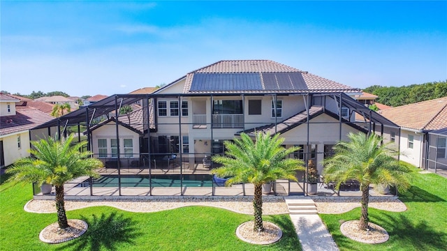 1211 Terralago Way, Kissimmee, FL 34746 - back of house with a tiled roof, a patio, a yard, and a lanai