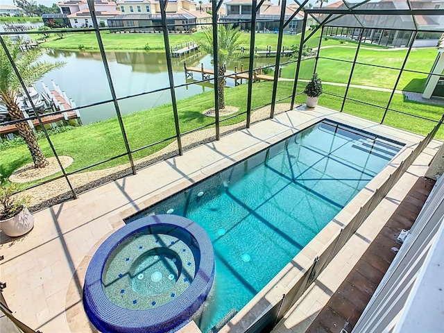 1211 Terralago Way, Kissimmee, FL 34746 - view of pool featuring a pool with connected hot tub, a water view, a lanai, and a yard