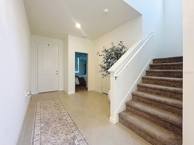 895 Overpool Ave, Davenport, FL 33896 - staircase featuring tile patterned flooring