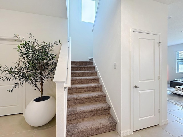 895 Overpool Ave, Davenport, FL 33896 - stairs featuring tile patterned flooring