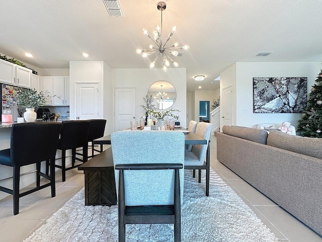 895 Overpool Ave, Davenport, FL 33896 - dining space featuring a chandelier, light tile patterned floors, and recessed lighting