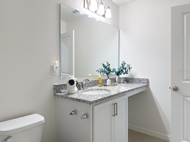 895 Overpool Ave, Davenport, FL 33896 - half bath with vanity, toilet, and tile patterned flooring