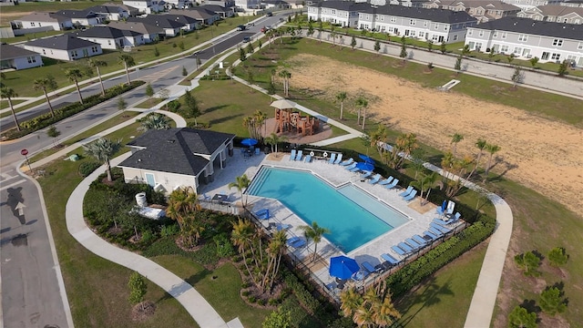 895 Overpool Ave, Davenport, FL 33896 - aerial view of property's location with a pool and nearby suburban area