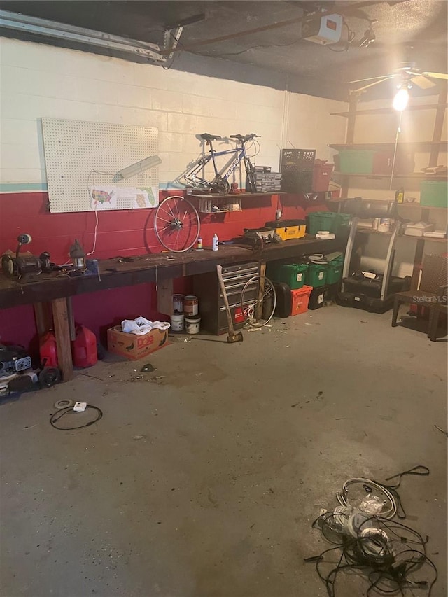 848 Wildabon Ave, Lake Wales, FL 33853 - garage with a garage door opener, a workshop area, and concrete block wall