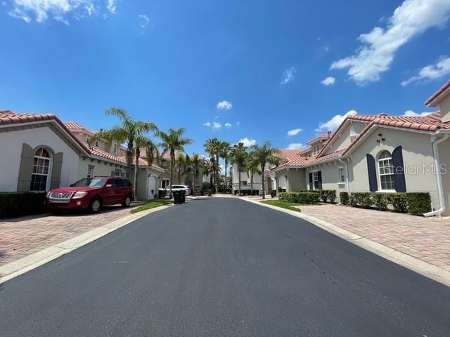 833 Brunello Dr, Davenport, FL 33897 - view of asphalt street with a residential view and curbs