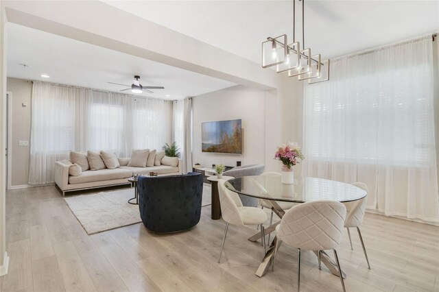8042 Glenlloyd Ave, Winter Garden, FL 34787 - dining space featuring a ceiling fan and light wood-type flooring