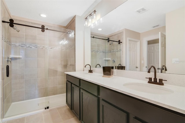 8042 Glenlloyd Ave, Winter Garden, FL 34787 - bathroom with a stall shower, double vanity, and tile patterned flooring