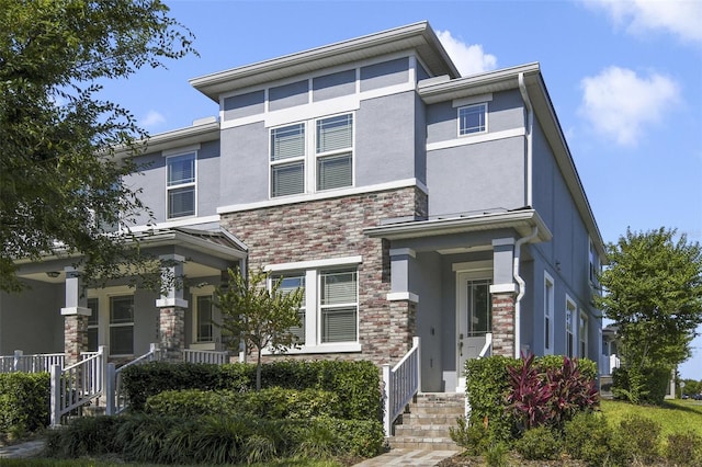 8042 Glenlloyd Ave, Winter Garden, FL 34787 - prairie-style home featuring stucco siding and stone siding