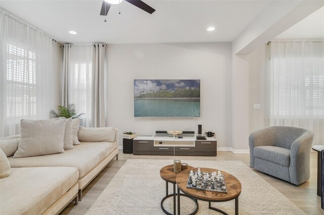 8042 Glenlloyd Ave, Winter Garden, FL 34787 - living area featuring ceiling fan, light wood finished floors, recessed lighting, and baseboards