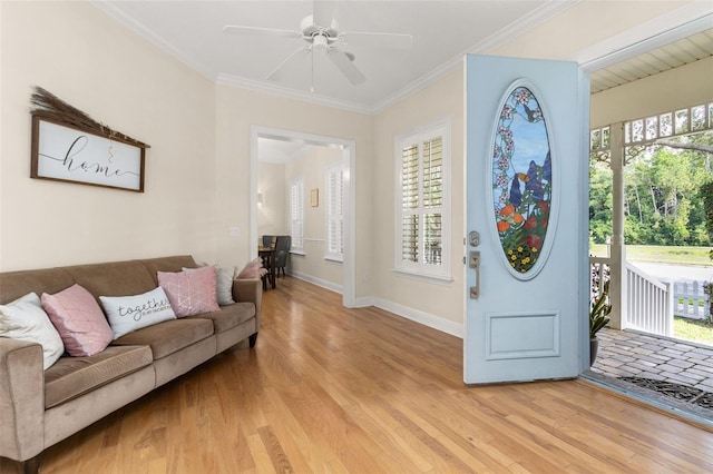 3349 Schoolhouse Rd, Harmony, FL 34773 - entryway with light wood finished floors, a ceiling fan, crown molding, and baseboards