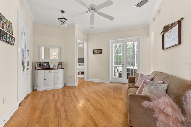 3349 Schoolhouse Rd, Harmony, FL 34773 - living room featuring light wood-type flooring, crown molding, a ceiling fan, and baseboards