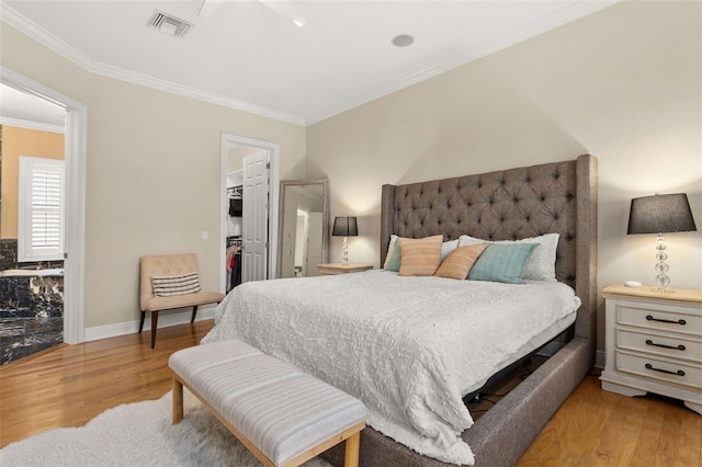 3349 Schoolhouse Rd, Harmony, FL 34773 - bedroom with ornamental molding, wood finished floors, a spacious closet, a closet, and baseboards