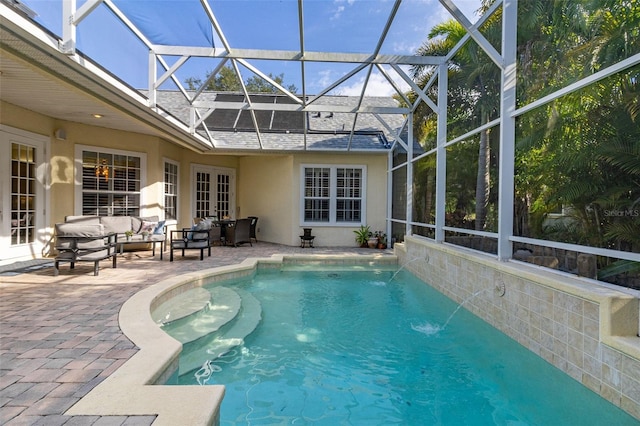 3349 Schoolhouse Rd, Harmony, FL 34773 - swimming pool featuring a patio, french doors, an outdoor hangout area, and glass enclosure
