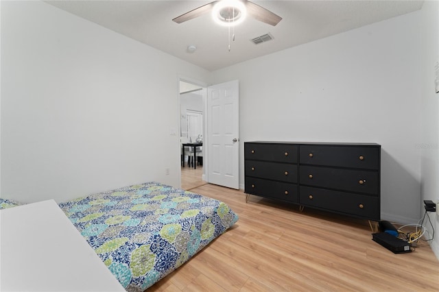 2507 Talega Dr, Saint Cloud, FL 34772 - bedroom featuring light wood finished floors and ceiling fan